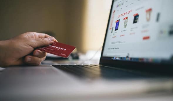 Person making online payment on smartphone while tracking Saving Money goals