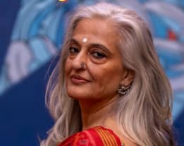 Seema Anand speaking during a public discussion on culture and society in India